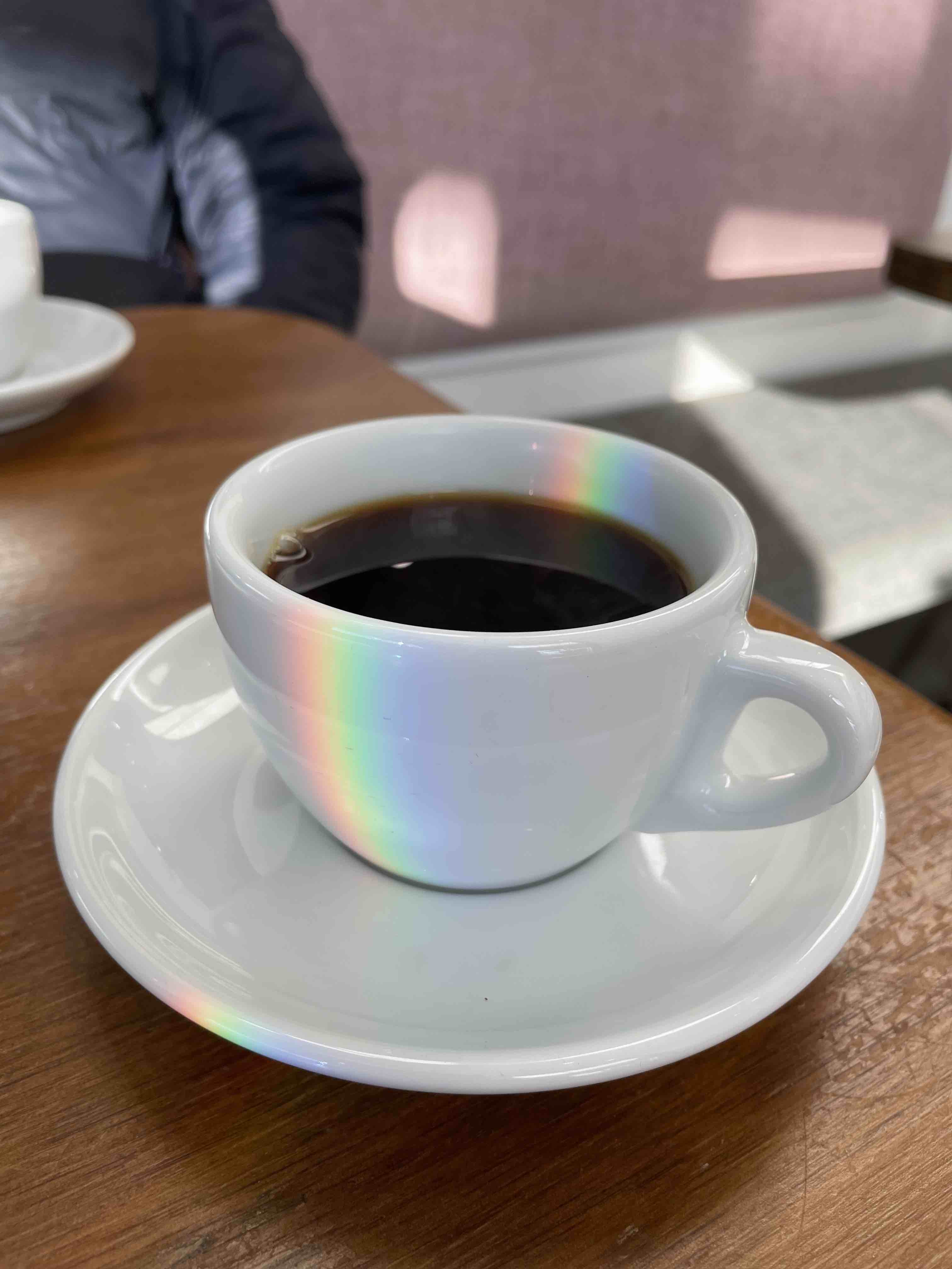 Coffe cup with a rainbow on it